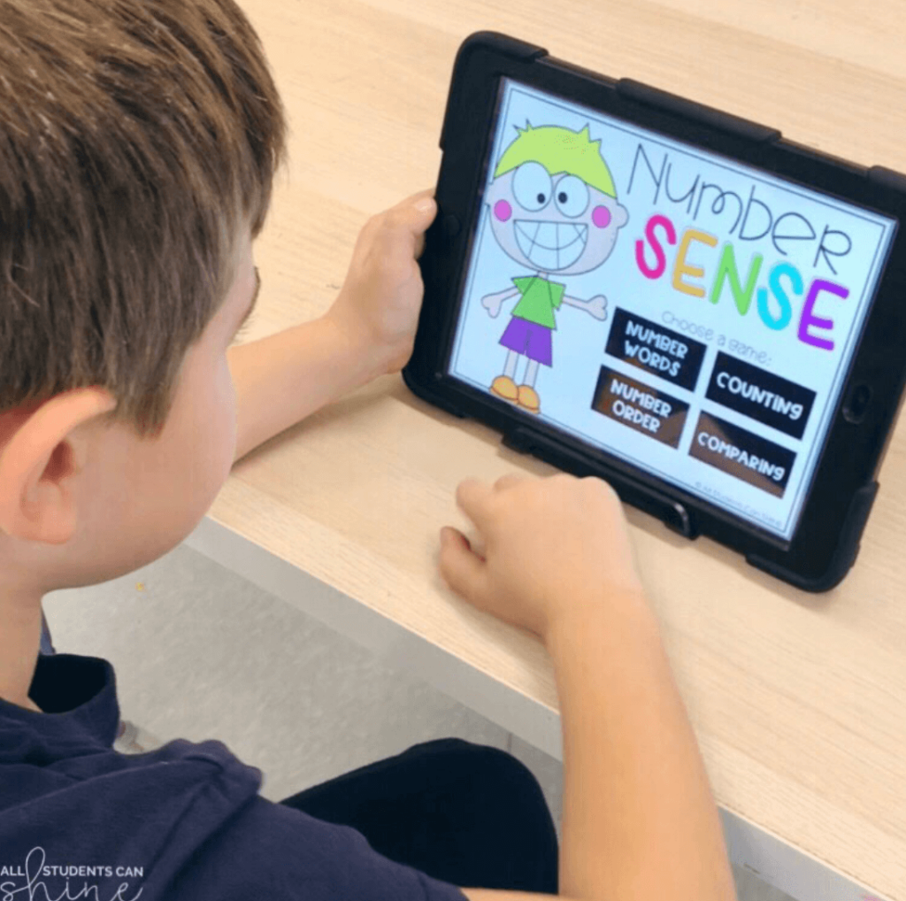 Young student plays a “Number Sense” digital game on a tablet, practicing counting, number order, and comparing numbers through interactive activities.