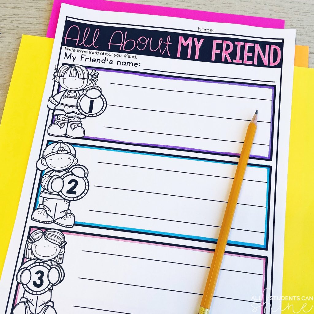 A printable friendship activity titled "All About My Friend," where students write three facts about a friend. The worksheet includes numbered writing sections with cartoon-style kids holding balloons. It’s placed on a desk with colorful paper underneath and a pencil on top, making it an engaging, no-prep free friendship activity for the classroom.