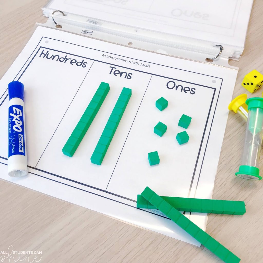 manipulatives place value mat with hundreds, tens, and ones using base ten blocks